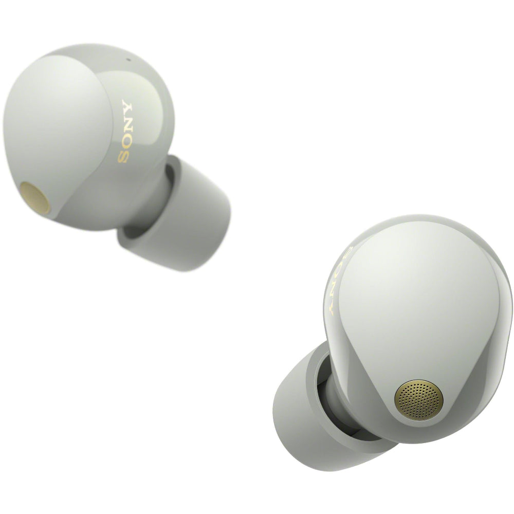 Close-up of silver WF-1000XM5 earbuds inside charging case