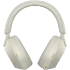 Slight tilt of silver WH-1000XM5 showing earcups and outer finish