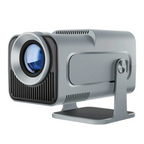 HY320 mini projector next to a 13‑inch laptop to illustrate its compact portable size.