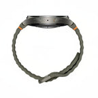 Samsung Galaxy Watch 7 44mm Green on desk next to wireless earbuds and keys for lifestyle flatlay