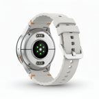 Product shot of Galaxy Watch7 44mm Silver with box, charging puck and documentation arranged on a table.