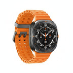 Side‑on image of Galaxy Watch Ultra 47mm strapped over a ski jacket, showing large crown and lugs.