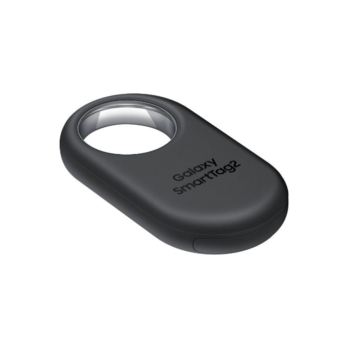 Galaxy SmartTag2 Black partially submerged in shallow water to demonstrate IP67 water resistance.