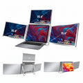 TRION QUAD TRIFOLD 15.6" folded down into compact form beside a laptop and travel bag


