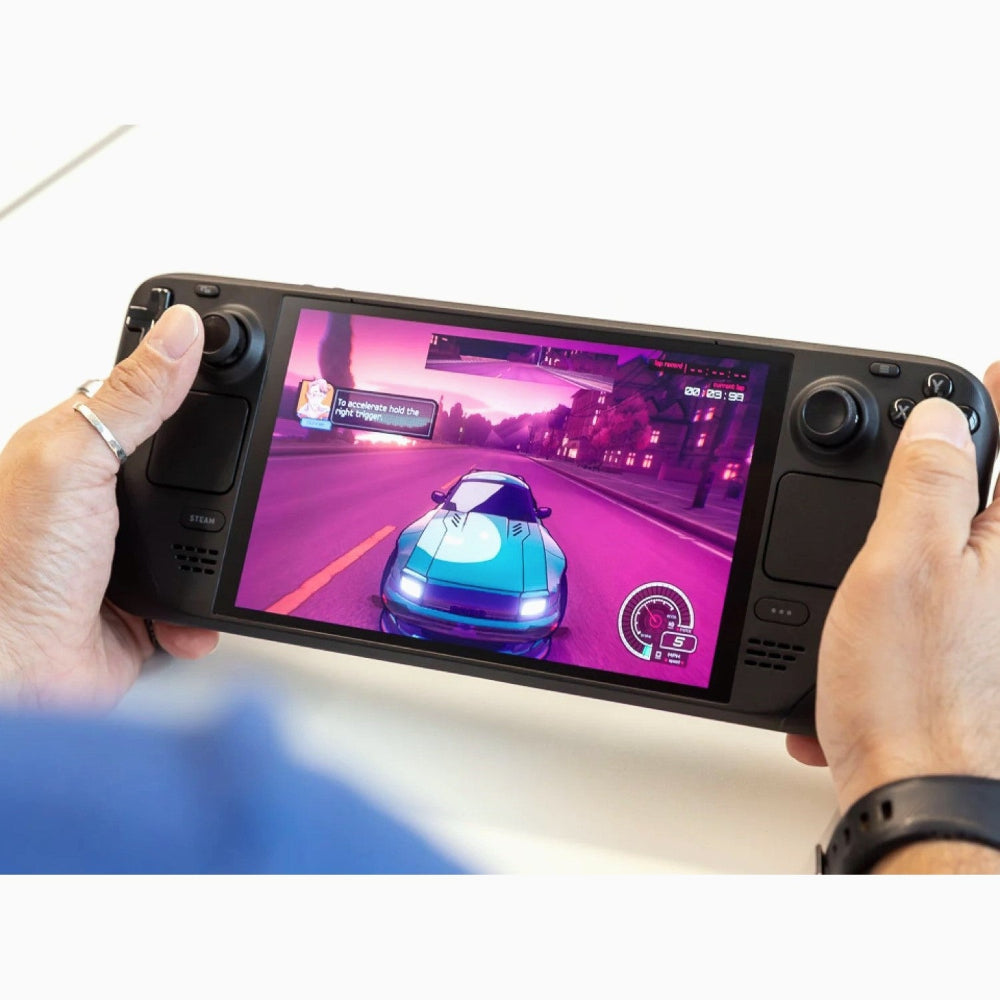 Steam Deck OLED packaging box positioned behind the handheld console and included accessories.​

